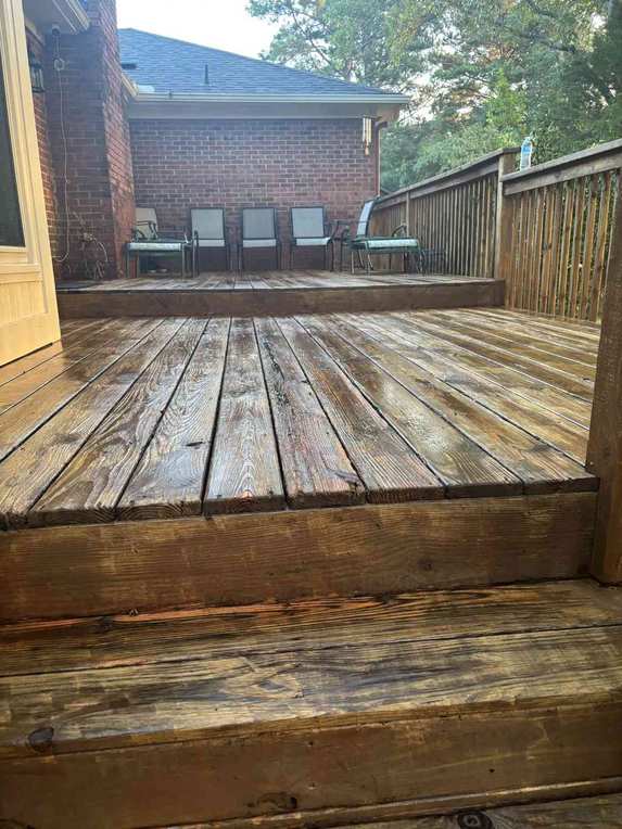 Clean restored wood deck after Moore Lawncare pressure washing