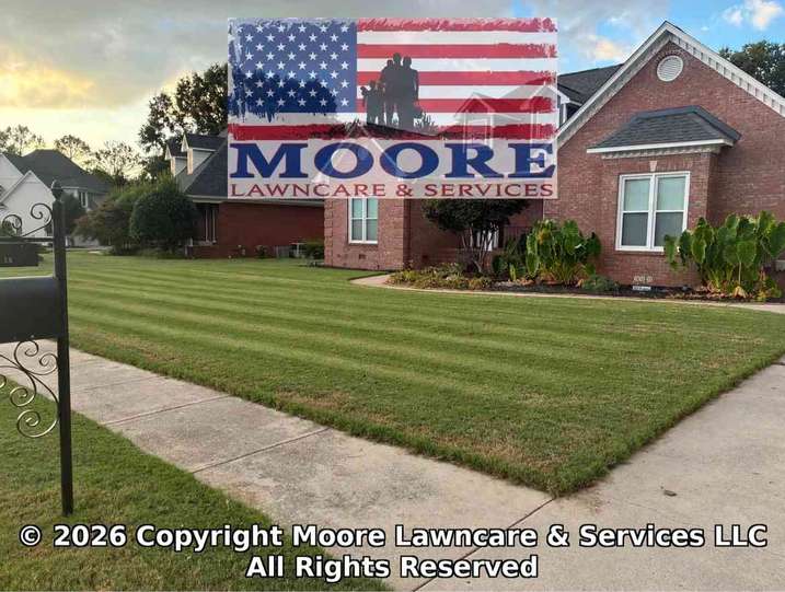 A real Moore Lawncare project with precise mowing stripes and clean edging